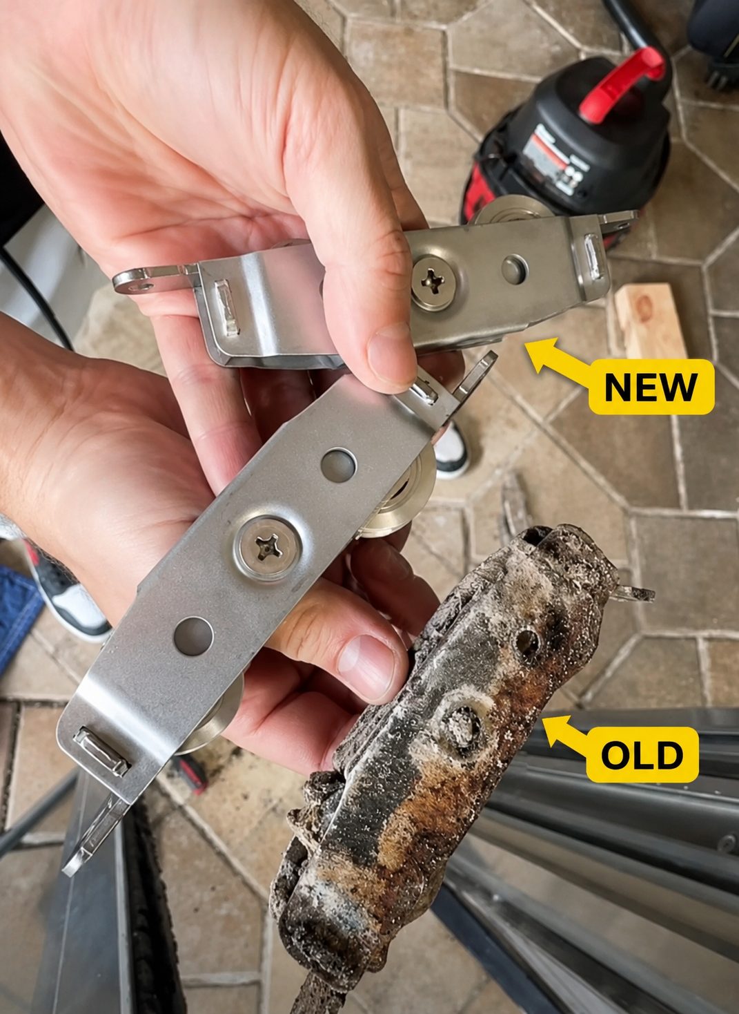 New sliding door roller next to a worn-out old roller